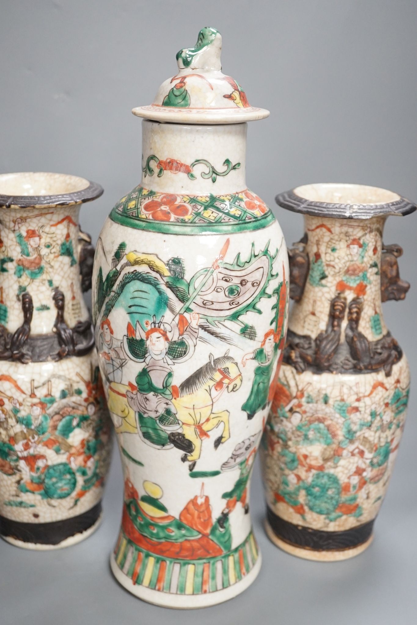 A pair of Chinese crackle glaze vases, a similar vase and cover, and another, late 19th/early 20th century (4), tallest 29 cms high.